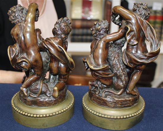 A pair of late 19th / early 20th century patinated bronze putti groups, 9.25in.